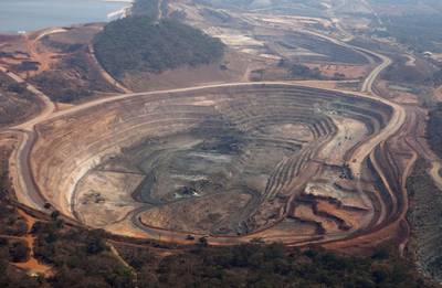 FILE: The open pits of the Mutanda copper mine are seen in this aerial view in Katanga province, Democratic Republic of Congo, on Wednesday, Aug. 1, 2012. Glencore Plc tumbled the most in two years as its African troubles escalated dramatically after U.S. authorities demanded documents relating to possible corruption and money laundering. The world’s biggest commodity trader said Tuesday that it’s been subpoenaed by the U.S. Department of Justice to produce documents with respect to compliance with the Foreign Corrupt Practices Act and United States money laundering statutes. Our editors select archive images from Glencore’s Katanga Mining Ltd. and Mutanda operations in the Democratic Republic of Congo. Photographer: Simon Dawson/Bloomberg