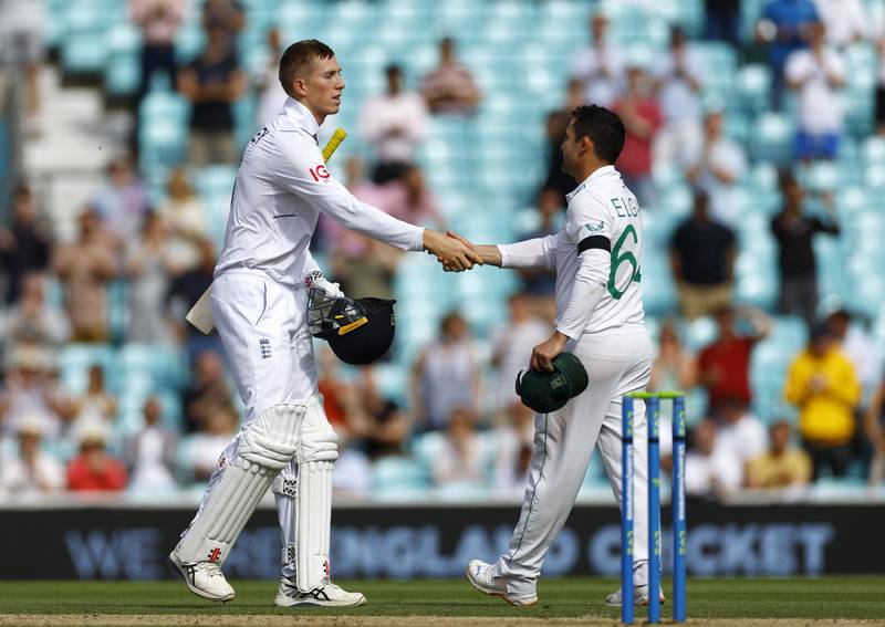 England's Zak Crawley and South Africa captain Dean Elgar shake hands after the match. Reuters