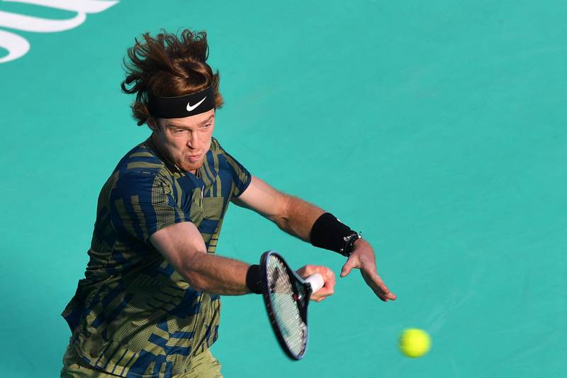 Andrey Rublev plays a forehand to Stefanos Tsitsipas. AFP