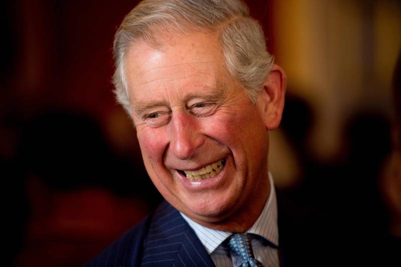 King Charles III reacts to a comment as he meets guests during a reception in Clarence House, central London, in 2013.  The planning for each day was "meticulous" while he was Prince of Wales, a former aide has said. AFP