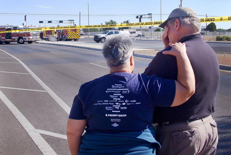 Pilot Ursula Richards, left, comforts fellow pilot Buzz Biernacki at the scene of the fatal hot-air balloon crash at Unser and Central SW in Albuquerque, New Mexico. AP Photo