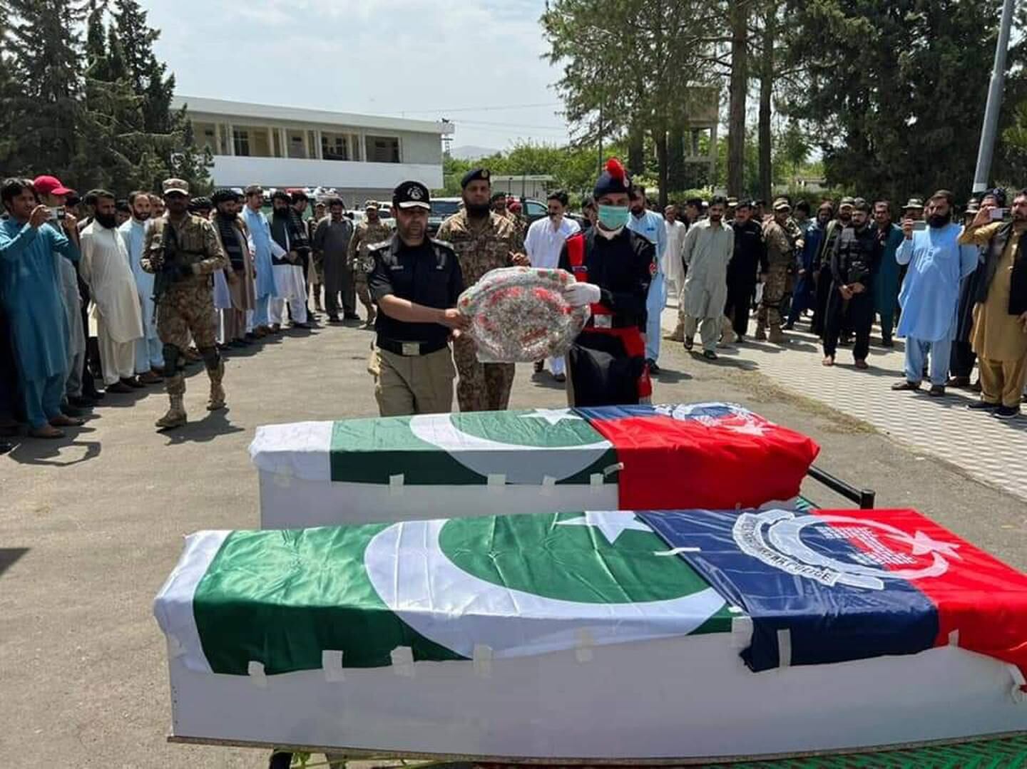 Police officials attend the funeral of two officers killed while guarding a polio vaccination team in Data Khel area of North Waziristan tribal region near the Afghan border, in Pakistan, in June. EPA