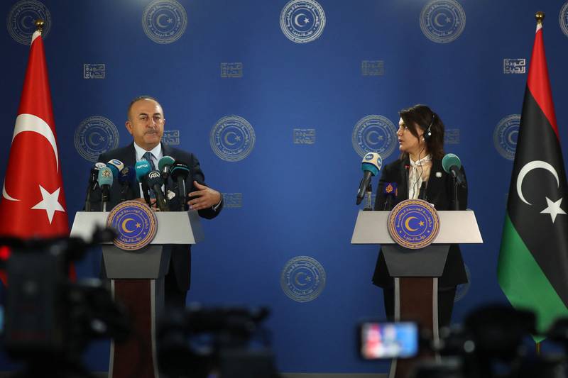 Turkish Foreign Minister Mevlut Cavusoglu, left, and his counterpart in the Tripoli government, Najla Mangoush, at a press conference in the Libyan capital on Monday. AFP