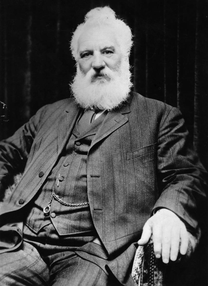 Scottish inventor Alexander Graham Bell ( 1847 -  1922 ) who invented the telephone. Bell, born in Edinburgh, worked with his father, Scottish educator Alexander Melville Bell, before emigrating to North America in 1871. In 1873 he became Professor of Vocal Phisiology at Boston University. He experimented with various devices for transmitting sound until he sent the first acoustic message to his assistant in 1875. Bell patented the telephone the next year and went on to invent the photophone and gramophone. He also founded the journal  'Science' and invented the tetrahedral kite.   (Photo by Topical Press Agency/Getty Images)