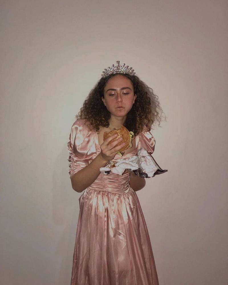 The student opted for some 1980s-style prom wear, plus tiara, to enjoy some fast food, writing: 'Fried chicken joes burgers are really good." Instagram