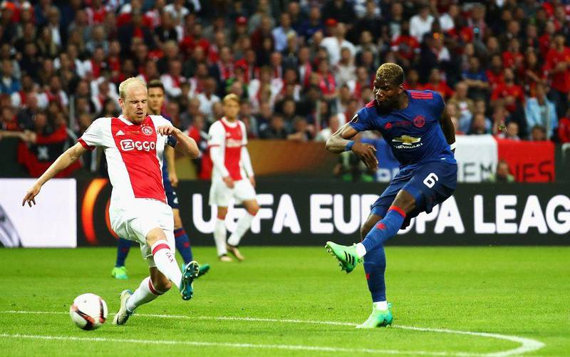 Manchester United midfielder Paul Pogba scores the opening goal. Dean Mouhtaropoulos / Getty Images