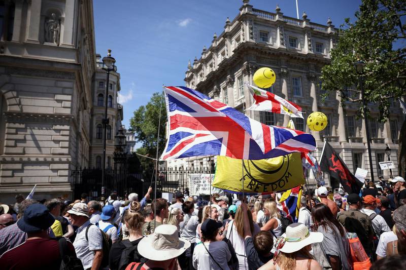 Anti-lockdown and anti-vaccine demonstrators take part in a protest in Downing Street, amid the coronavirus disease (COVID-19) pandemic, London, Britain, June 14, 2021. REUTERS/Henry Nicholls