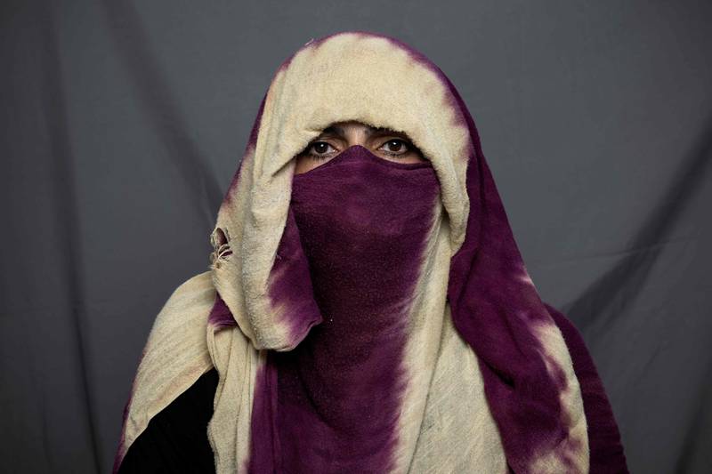 Baker Shapari, 40, poses for a portrait in Kandahar, Afghanistan. Since their takeover a year ago, the Taliban have squeezed Afghan women out of public life. AFP