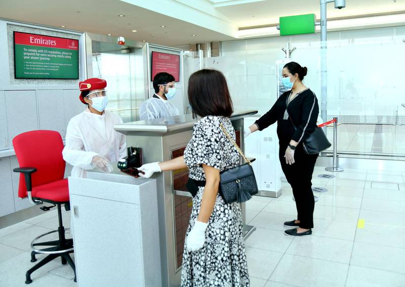 Crew at Emirates boarding gates will also wear protective aprons, masks and gloves. Courtesy Emirates 