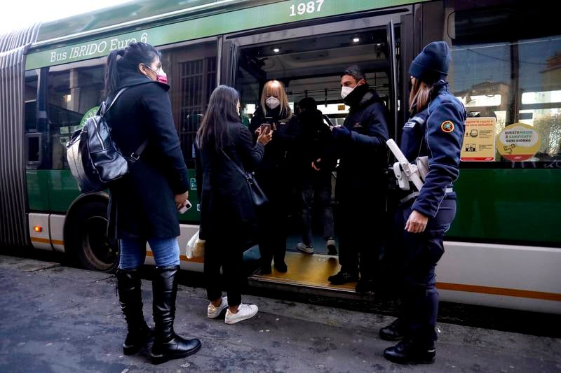 Passengers at a metro station  in northern Italian city of Milan are being screened for Covid-19 vaccine certificate. EPA