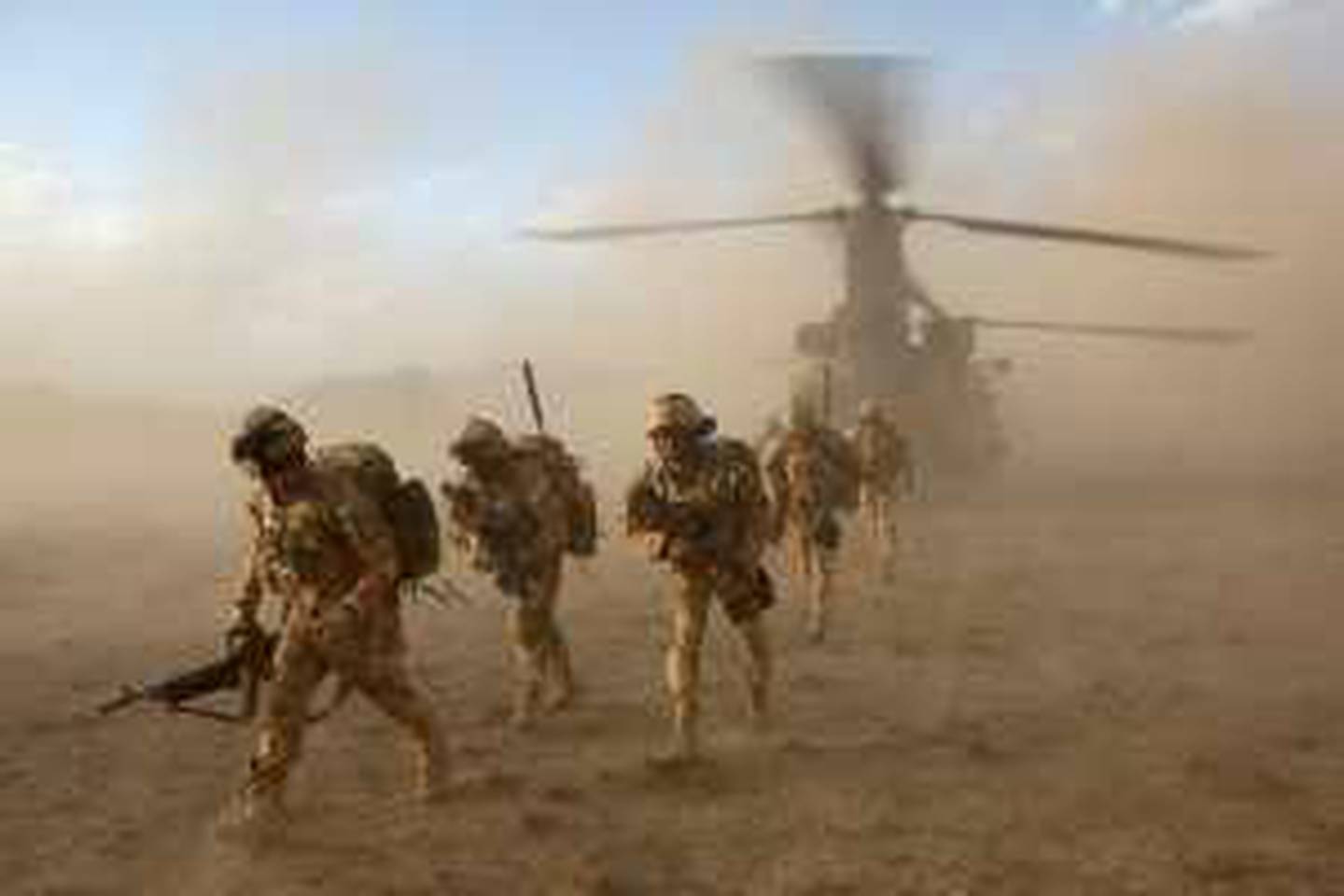 In this image made available by the Ministry of Defence in London, Monday June 8, 2009, British soldiers of the The Black Watch, 3rd Battalion, The Royal Regiment of Scotland, deploy from a Chinook helicopter in the desert of Afghanistan's Upper Sangin Valley, Sunday May 31, 2009, at the start of a joint operation with the Afghan National Army, to search compounds and destroy drug caches and narcotic manufacturing facilities. The operation destroyed ten narcotic manufacturing facilities, and as well as the opium, it netted 220 kg of morphine, more than 100 kg of heroin and 148 kg of cannabis.(AP Photo/Corporal Rupert Frere, Ministry of Defence, ho)  **EDITORIAL USE ONLY**