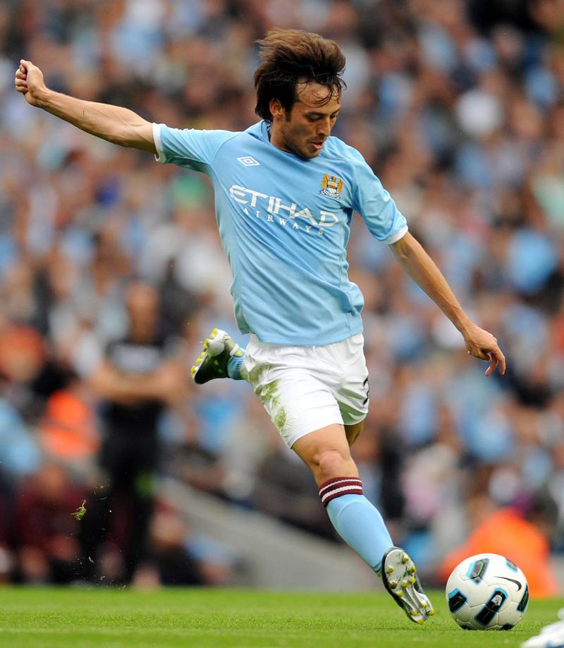 Manchester City's David Silva shoots at goal against Valencia during the international pre-season friendly football match at The City of Manchester stadium on August 7, 2010. AFP PHOTO / ADRIAN DENNIS

FOR EDITORIAL USE ONLY Additional licence required for any commercial/promotional use or use on TV or internet (except identical online version of newspaper) of Premier League/Football League photos. Tel DataCo +44 207 2981656. Do not alter/modify photo. (Photo by ADRIAN DENNIS / AFP)