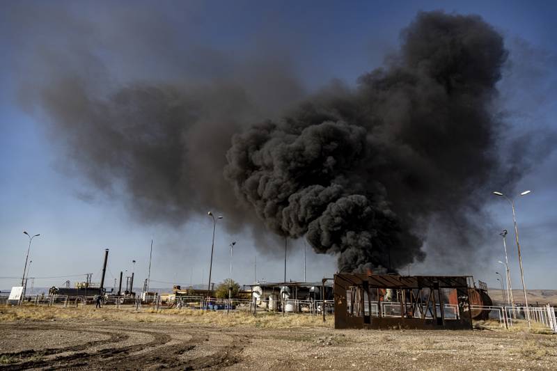 Smoke rises from an oil depot after a Turkish air strike near the town of Qamishli in north-east Syria. AP