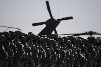 US soldiers on parade during the visit of Nato Secretary General Jens Stoltenberg to the Mihail Kogalniceanu airbase, near Constanta, eastern Romania. AP
