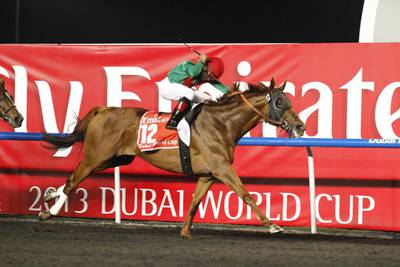 Animal Kingdom ridden by Joel Rosario wins the 18th running of the Dubai World Cup in 2013. Razan Alzayani / The National
