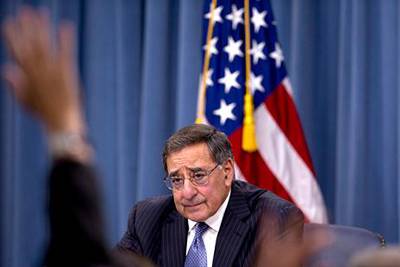 Defense Secretary Leon Panetta looks to the media to take a question as he participates in a joint news conference with Joint Chiefs Chairman Gen. Martin Dempsey, not seen, at the Pentagon, Thursday, Oct. 25, 2012. Panetta said the U.S. military did not intervene during the attack on the U.S. Consulate in Libya last month because it was over before the U.S. has sufficient information on which to act.  (AP Photo/Carolyn Kaster)