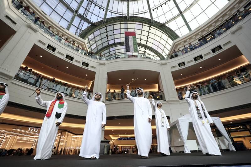 Dubai, United Arab Emirates - December 02, 2018: Traditional Emirati dancing performed on stage at MOE. Sunday the 2nd of December 2018 at Mall of the Emirates, Dubai. Chris Whiteoak / The National