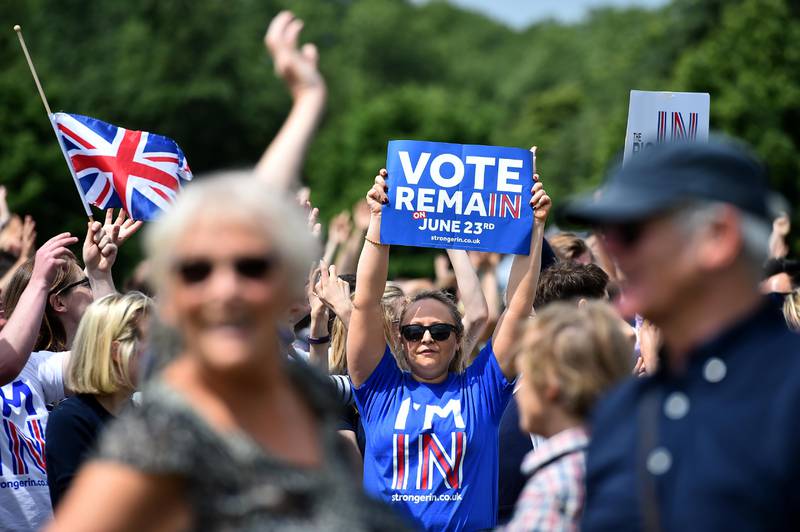A woman holds a placard as she attends a rally for 'Britain Stronger in Europe', the official 'Remain' campaign group seeking to a avoid Brexit, ahead of the the forthcoming EU referendum, in Hyde Park in London on June 19, 2016.
The International Monetary Fund (IMF) warned last week that if Britain votes to exit the European Union on June 23, it could deal the economy a "negative and substantial" blow. / AFP PHOTO / BEN STANSALL