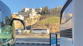 Who's taking the reopened bus route from Jordan to Syria?
