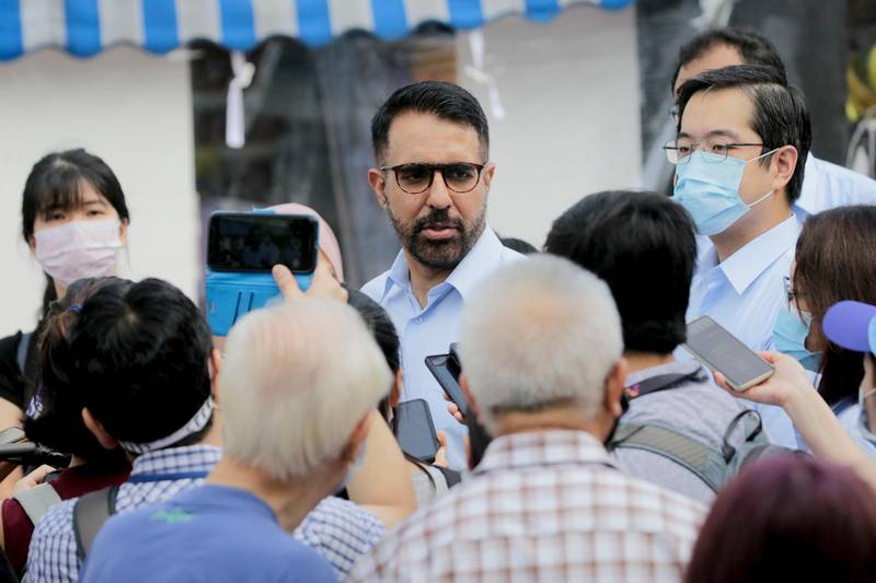 Opposition Worker's Party secretary-general Pritam Singh surrounded by members of the media during a campaign walkabout ahead of the general elections in Singapore last week. EPA