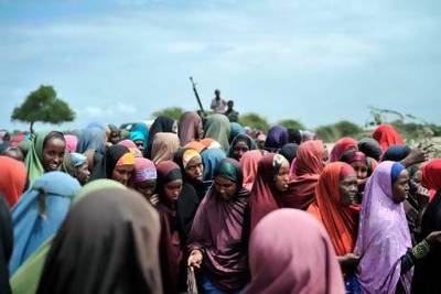 Displaced women lining up at a food distribution centre in Afgoye, Somalia where the UAE Red Crescent was giving out food aid as part of a Ramadan programme. Handout from African Union-United Nations Information Support Team