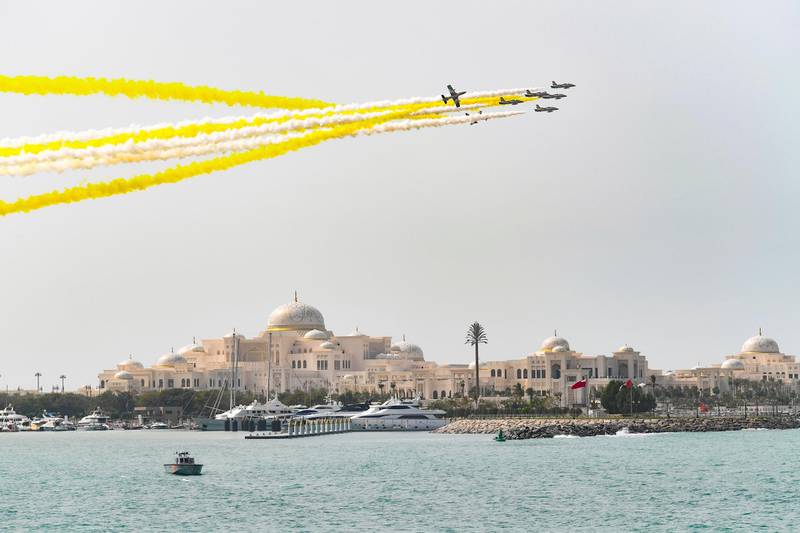 ABU DHABI, UNITED ARAB EMIRATES - February 04, 2019: Day two of the UAE Papal visit - The Al Forsan Aerobatics team display the colors of the Vatican flag during an official ceremony at the Presidential Palace. 

( Handout )
---