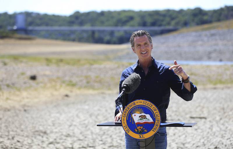 Mr Newsom asked people to voluntarily reduce their water use by 15 per cent in the middle of the drought.  Kent Porter / The Press Democrat via AP