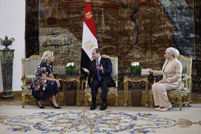Mr El Sisi with Ms Amer and Ms Biden. AFP