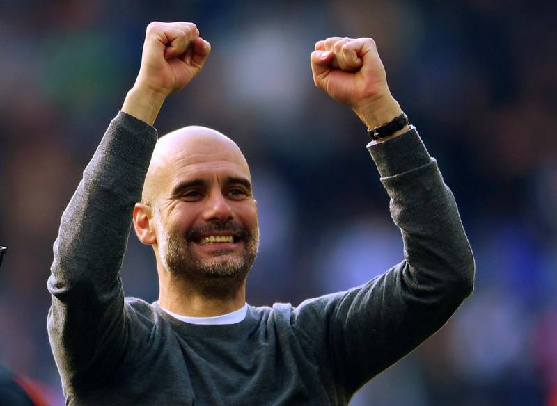 Manchester City manager Pep Guardiola celebrates winning the Premier League title. Reuters