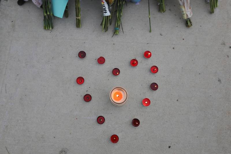 Candles are arranged in a heart shape at a makeshift memorial to the members of Muslim family killed by a hit-and-run driver in London, Ontario, Canada. Reuters