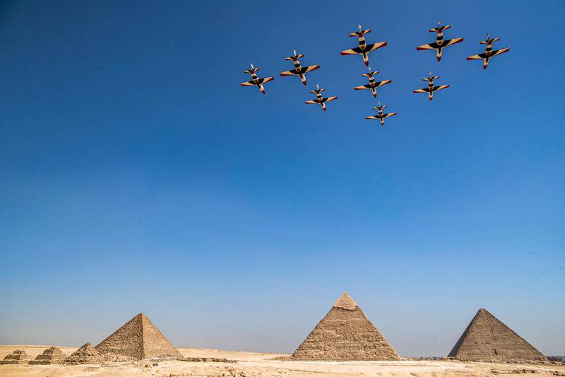 They fly above (R to L) the Great Pyramid of Khufu, the Pyramid of Khafre and the Pyramid of Menkaure. AFP
