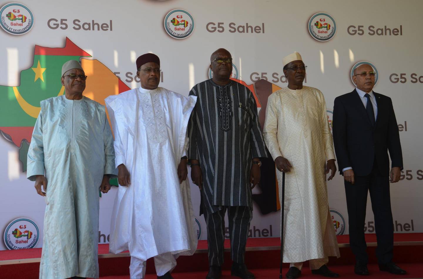 Ibrahim Boubacar Keïta(L), the President of Mali, Mahamadou Issoufou(2ndL), the President of Niger, Roch Marc Christian Kaboré(C), the President of Burkina Faso, Idriss Déby(2ndR), the President of Chad, and Mohamed Ould Cheikh Mohamed Ahmed Ould Ghazouani(R), the President of Mauritania, pose for a photo at the G5 Sahel summit in Niamey, on December 15, 2019. Leaders of the G5 Sahel nations paid homage at the graves of 71 Niger military personnel killed in a jihadist attack on December 10, 2019, ahead of a regional summit to coordinate a response to the growing unrest.
 / AFP / BOUREIMA HAMA
