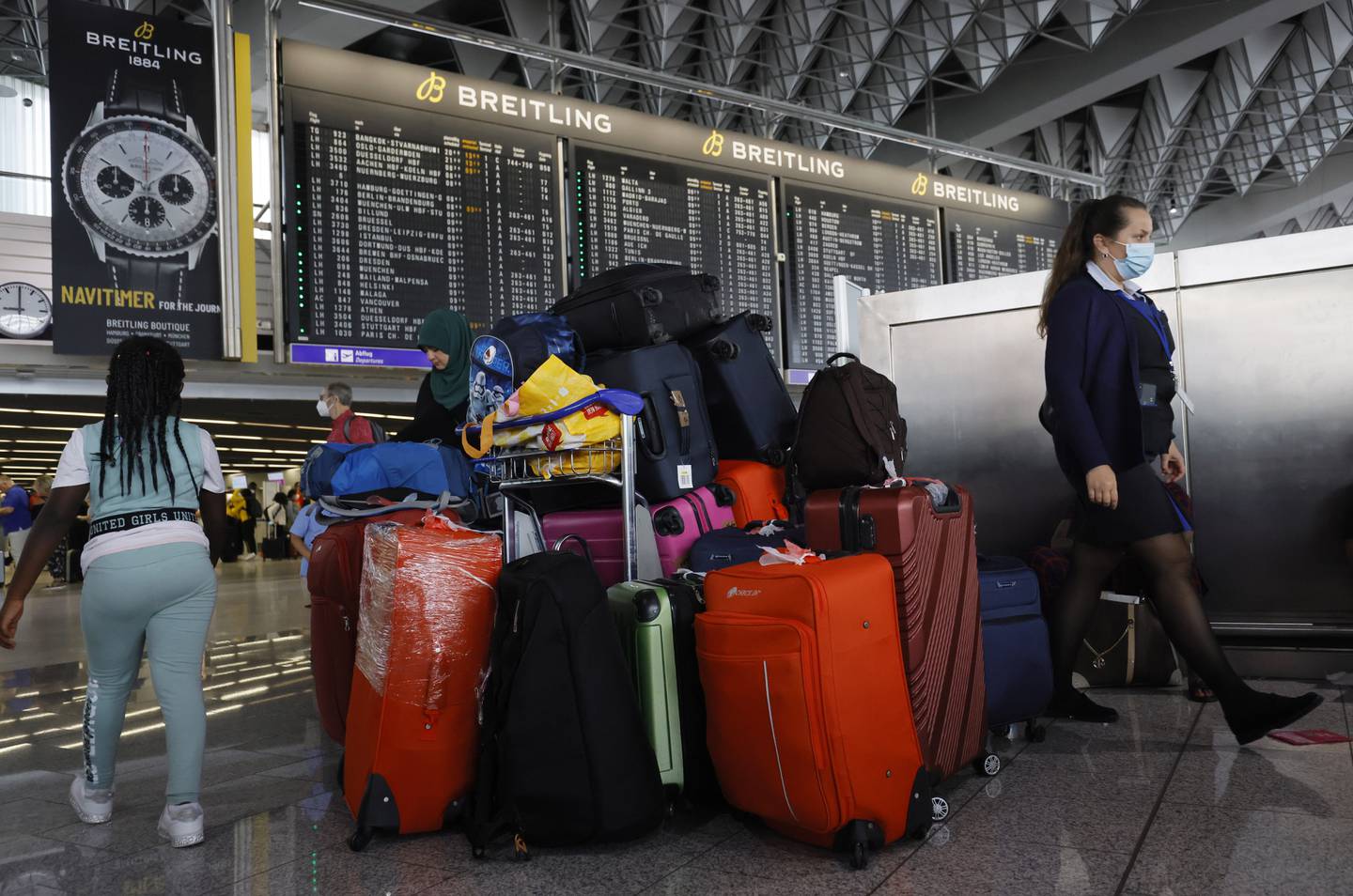 Luggage has been piling high at airports around the world, including this trolley in Frankfurt's airport, Germany. EPA