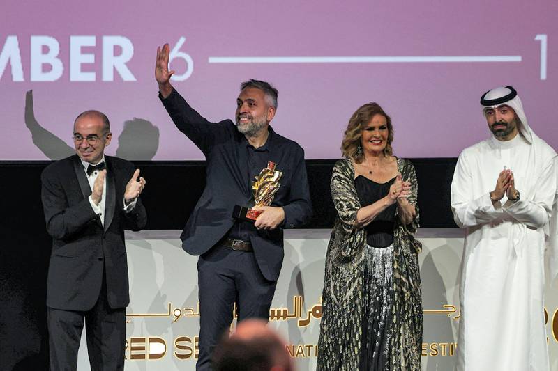 Georgian director Levan Koguashvili, second left, receives the Best Film award. AFP