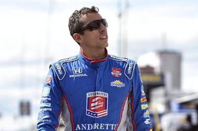 Justin Wilson, of England, walks on pit road during qualifying on Saturday for the Pocono IndyCar 500 race, during which he was injured in a crash on Sunday. On Monday he died from the injuries. Derik Hamilton / AP / August 22, 2015 