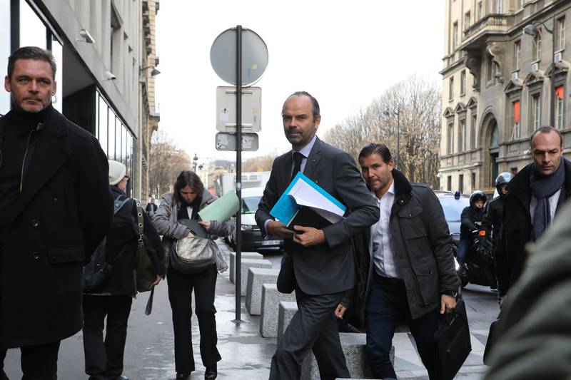 French Prime Minister Edouard Philippe arrives to announce the suspension on rising fuel taxes in Paris on December 4, 2018, a few days after the protests by the 'yellow vest' (gilets jaunes) movement.  The French government plans to announce on December 4 the suspension of fuel tax increases slated for January in a bid to quell the fierce protests which have ballooned into the deepest crisis of Emmanuel Macron's presidency, sources said. / AFP / ludovic MARIN
