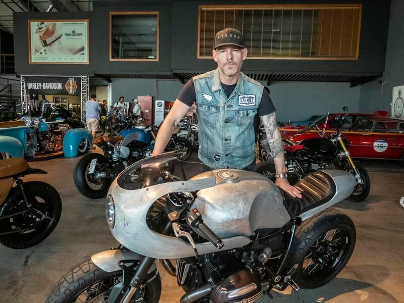 Motorcycle builder Stewart Holmes from Australia with his custom BMW R9T at the annual Art of Motorcycle show at Port Rashid in Dubai. Antonie Robertson / The National
