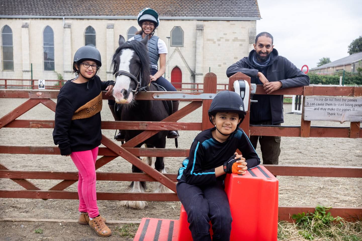 Aamilah Aswat, 15, sits on a horse along with, left to right, Hibbah Randaera, 11, Ishaaq Mohamedy, 13, and Imran Atcha. Mark Chilvers / The National