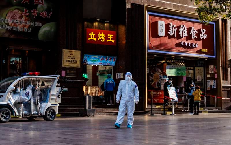 Police in protective gear patrol the Nanjing street shopping area, in Shanghai, China. EPA