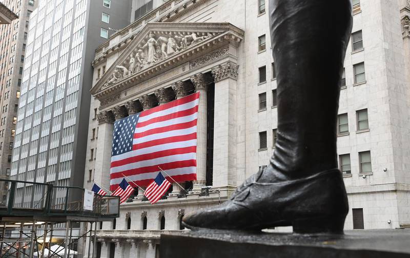 (FILES) In this file photo a view of the New York Stock Exchange is seen on Wall Street on March 23, 2020 in New York City. Wall Street stocks opened solidly higher on April 14, 2020, bouncing back from a lackluster session as major banks kicked off earnings season in the wake of economic hit from coronavirus shutdowns. About 25 minutes into trading, the Dow Jones Industrial Average had gained 2.5 percent to 23,968.76.The broad-based S&P 500 also rose 2.5 percent to 2,829.53, while the tech-rich Nasdaq Composite Index jumped 2.9 percent to 8,433.39.
 / AFP / Angela Weiss
