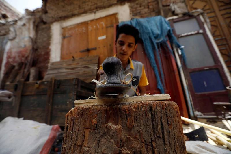 A Yemeni boy working as a carpenter on World Day Against Child Labour, in the country's capital, Sanaa. EPA