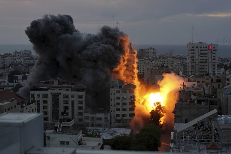 A ball of fire and smoke rises from an apartment tower following an Israeli air strike in Gaza City, Saturday, October 7, 2023. AP