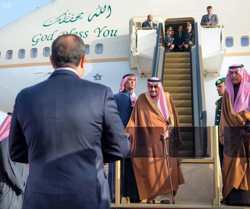 Egyptian President Abdel Fatah El Sisi waits to greet Saudi Arabia's King Salman as he arrives for the Arab-EU summit on February 23, 2019. Saudi Press Agency