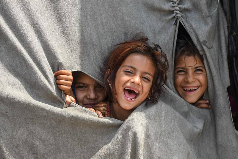 Children of Afghan refugees living on the outskirts of Lahore, Pakistan, in June. AFP