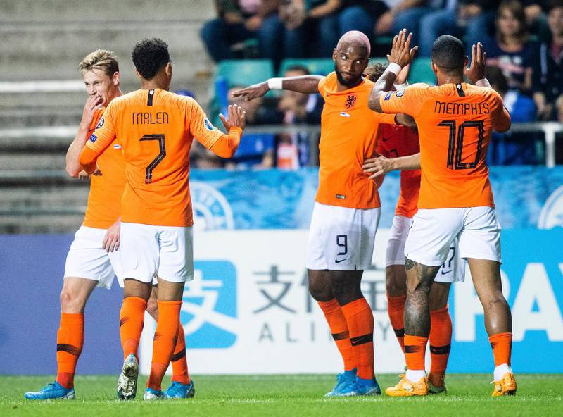 Netherlands' Ryan Babel, centre, and his teammates celebrate their side's first goal during the Euro 2020 group C qualifying soccer match between Estonia and Netherlands at the A. Le Coq Arena in Tallinn, Estonia, Monday, Sept. 9, 2019. (AP Photo/Raul Mee)