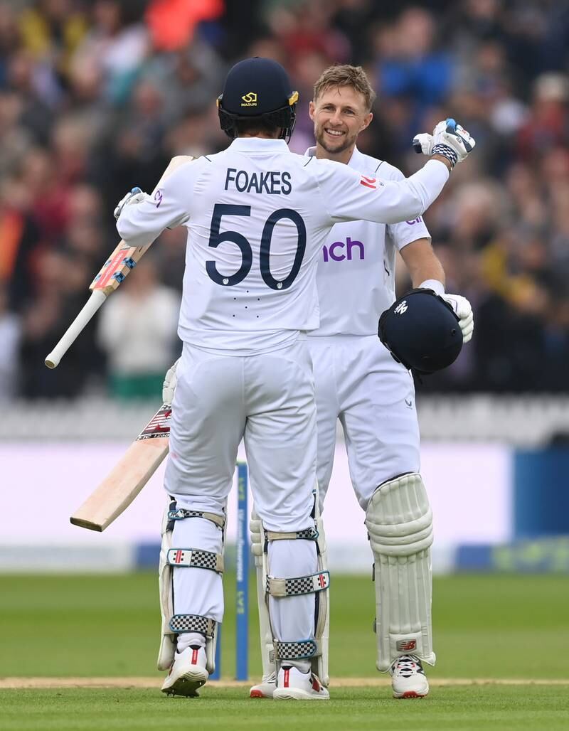 Joe Root is congratulated by Ben Foakes after reaching his century. Getty