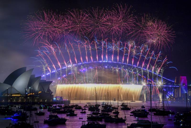 Fireworks explode over the Sydney Harbour Bridge as New Year celebrations begin, in Australia.  AP