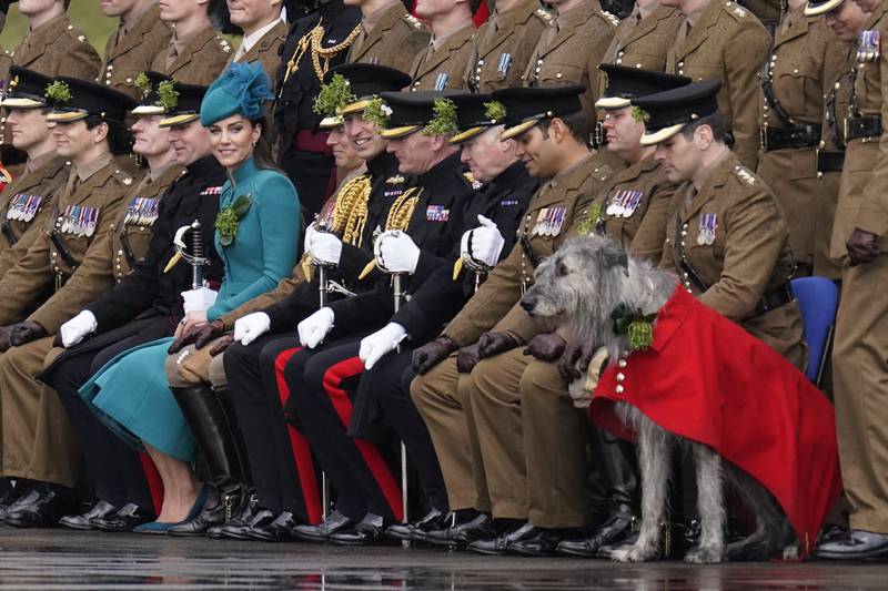The Prince and Princess of Wales pose for a group photo with the 1st Battalion Irish Guards. PA