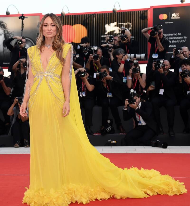 Olivia Wilde wears a canary yellow Gucci gown. EPA