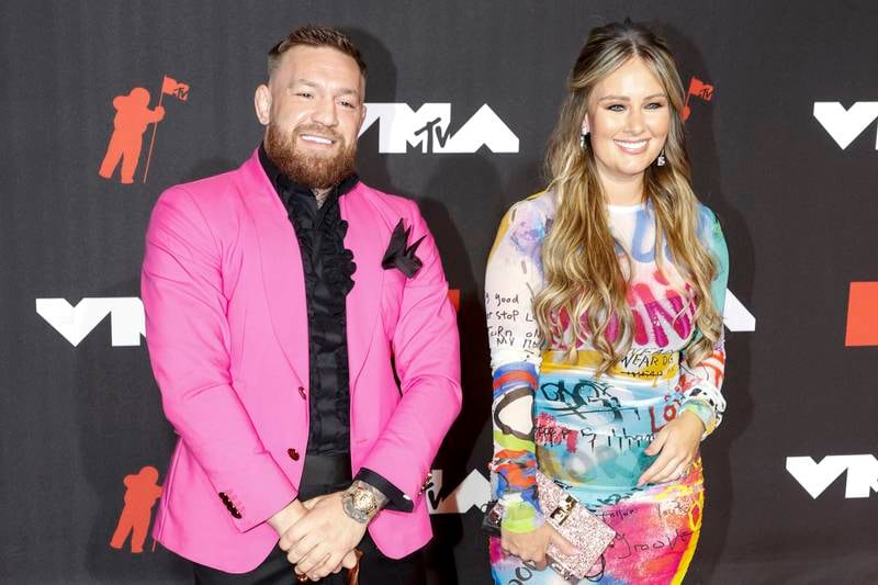 Irish mixed martial artist Conor McGregor and Dee Devlin arrive on the MTV Video Music Awards red carpet.